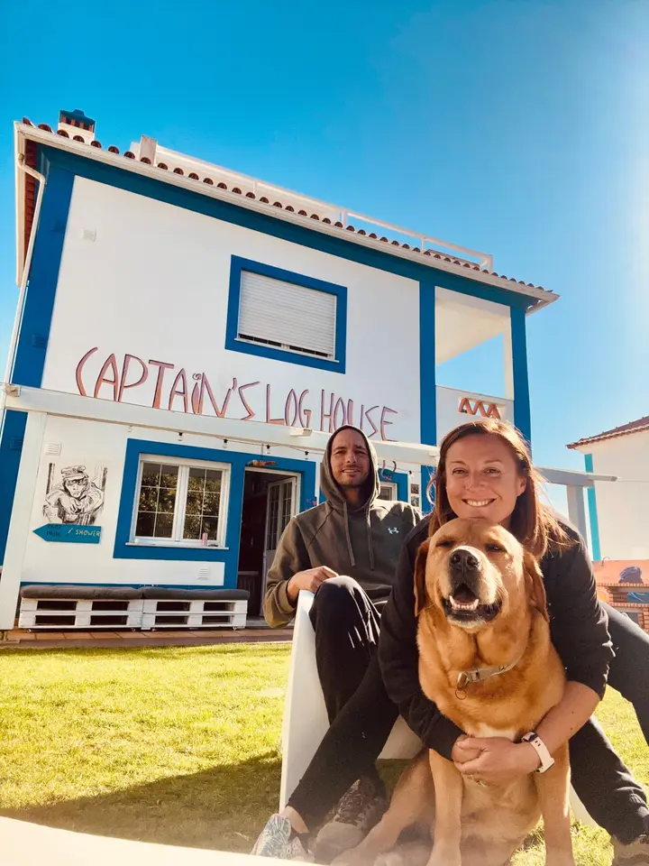 Caterina, Hugo and Pati the dog in front of Captain's Log House